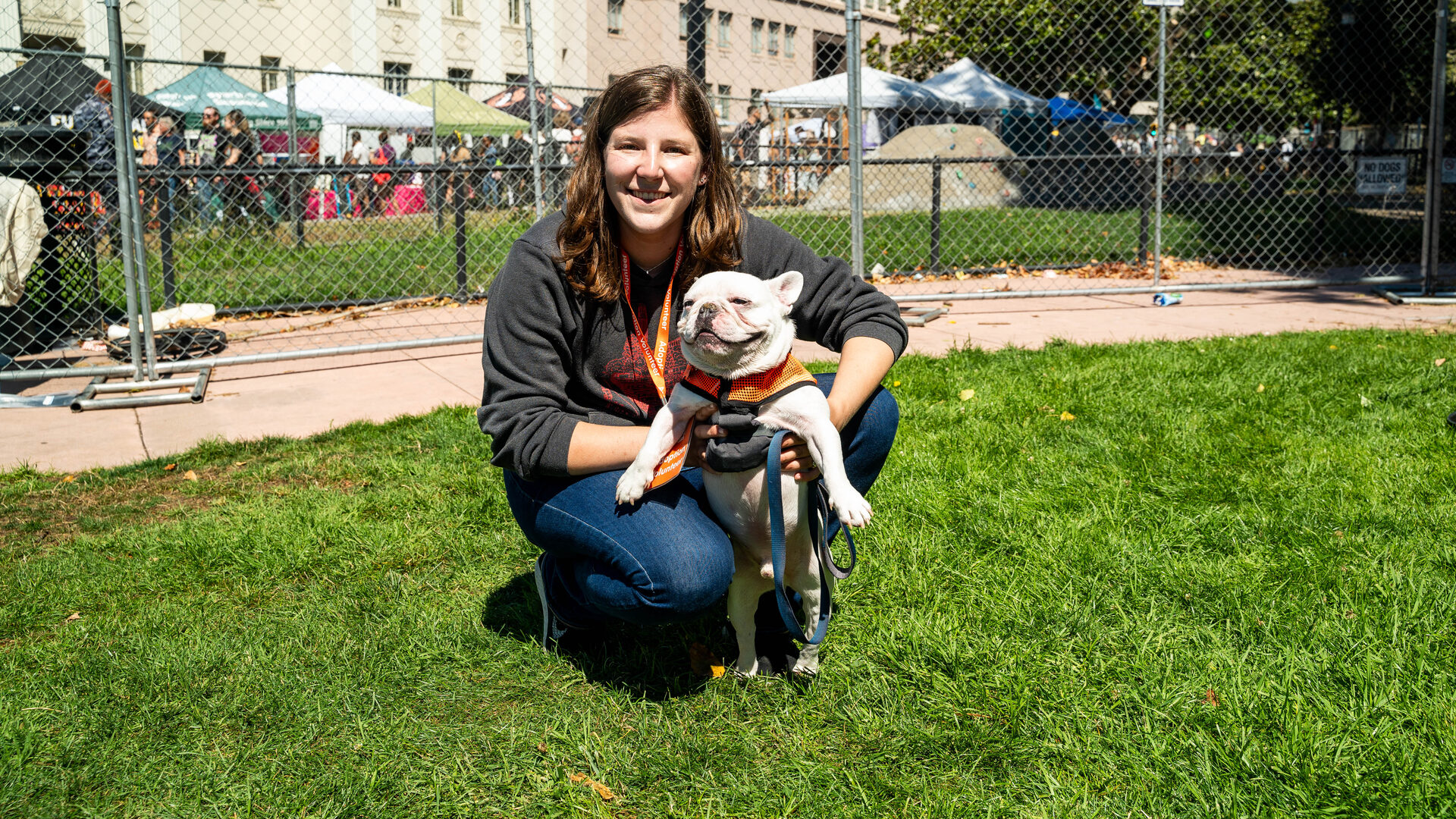 Bizerkeley Food Fest — a visitor with a rescue dog on the festival lawn